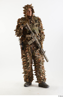 Frankie Perry Pose in Ghillie with Gun holding gun standing…